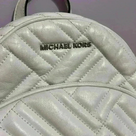 Michael Kors Abbey white quilted backpack. Silver hardware. Two zipper pockets. - Picture 3 of 12